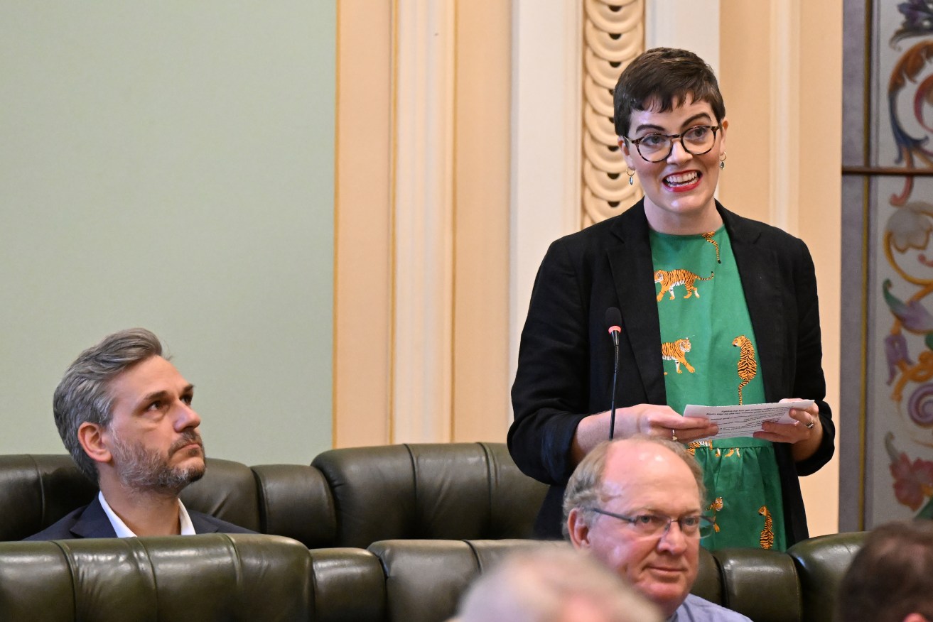 The Member for South Brisbane, Amy MacMahon (right) is seen addressing parliament during Question Time at Queensland Parliament in Brisbane, Tuesday, April 16, 2024. (AAP Image/Darren England) NO ARCHIVING