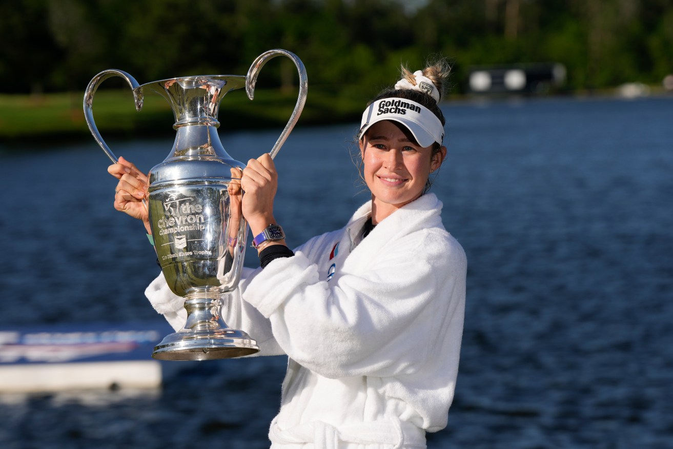 Nelly Korda poses with the trophy after winning the Chevron Championship LPGA golf tournament Sunday, April 21, 2024, at The Club at Carlton Woods in The Woodlands, Texas. (AP Photo/David J. Phillip)