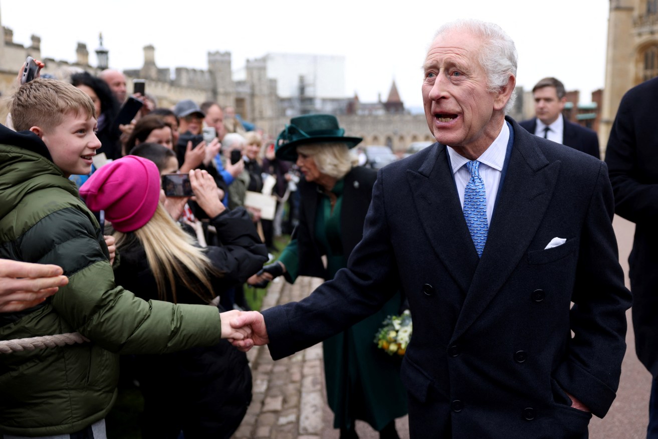 FILE - Britain's King Charles III and Queen Camilla greet people after attending the Easter Matins Service at St. George's Chapel, Windsor Castle, England, March 31, 2024. King Charles III is on the comeback trail. The 75-year-old British monarch will slowly ease back into public life after a three-month break to focus on his treatment and recuperation after he was diagnosed with an undisclosed type of cancer. (Hollie Adams/Pool Photo via AP, File)