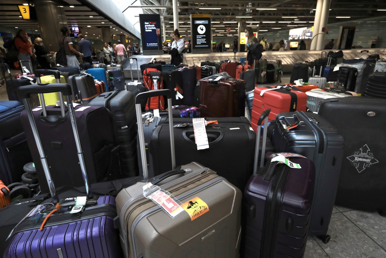 Lots of unpicked baggage are left at an arrival lobby of Heathrow Airport (LHR) in London, United Kingdom on June 25, 2022. At Heathrow Airport, the management system broke down and a large amount of luggage has been left unattended. There were a series of flight delays and cancellations. One of the reasons is that many employees were dismissed due to the new coronavirus COVID-19. ( The Yomiuri Shimbun via AP Images )