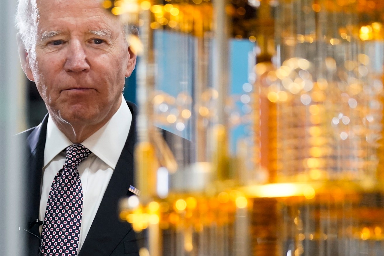 US President Joe Biden looks at the IBM System One quantum computer during a tour of an IBM facility in Poughkeepsie, N.Y. (AP Photo/Andrew Harnik)