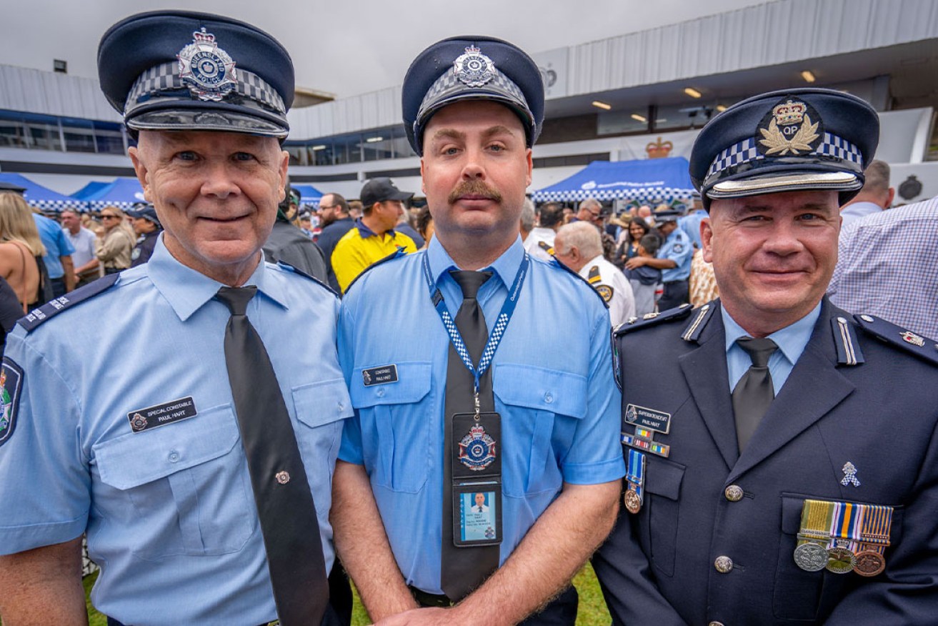 From left to right — Special Constable Paul Hart with son, First Year Constable Paul Hart, and Superintendent Paul Hart (Image: Supplied by Queensland Police).
