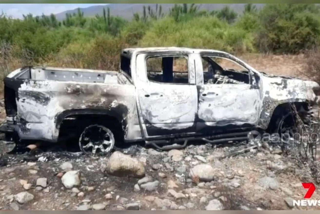The burned-out van over which two Australian brothers and their American friend were coldly murdered (Image, Channel 7).