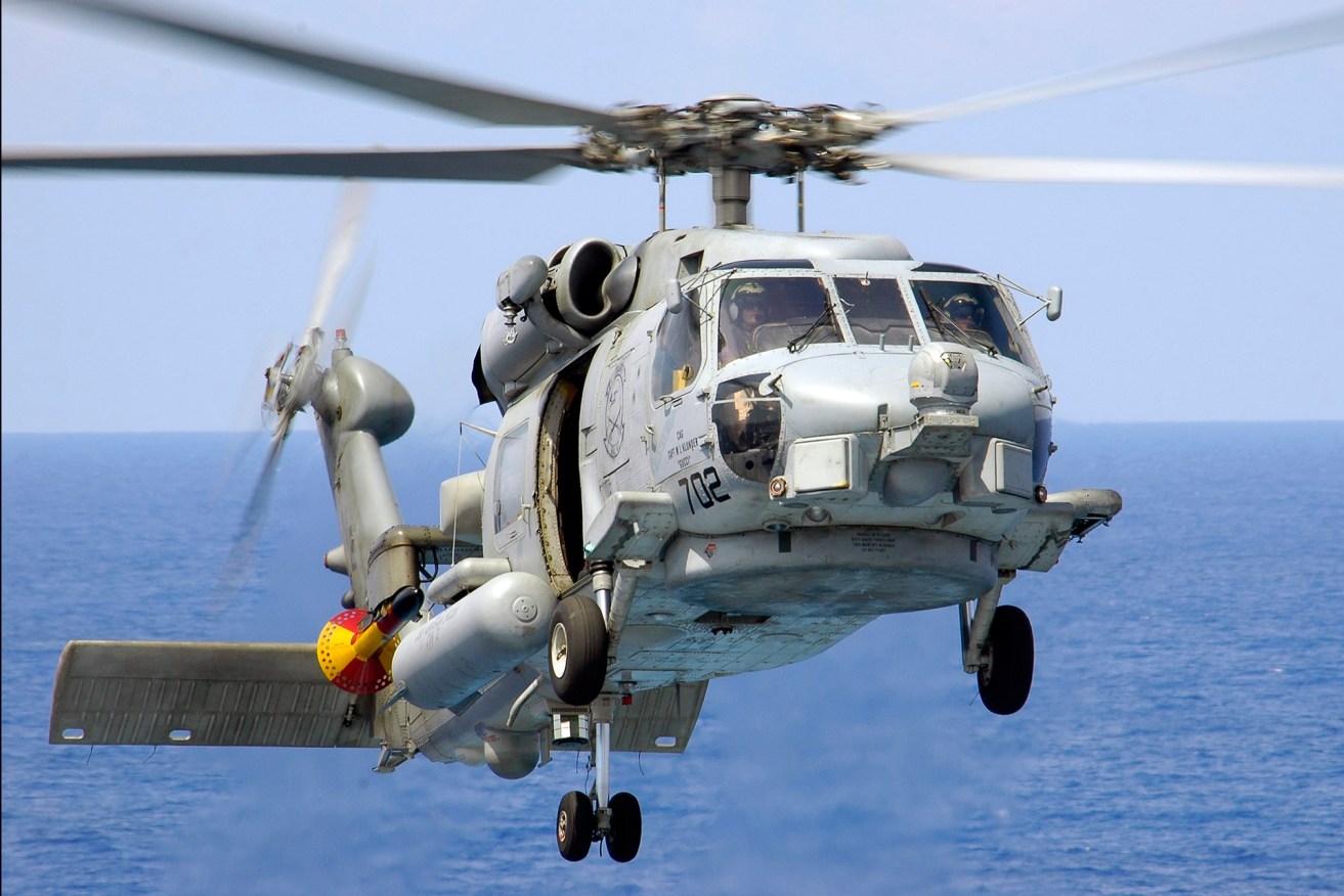An SH-60B Seahawk of Helicopter Antisubmarine Squadron Light 47 (HSL-47) "Saberhawks" approaches to land aboard the Nimitz-class aircraft carrier USS Abraham Lincoln photo by Photographer's Mate Airman James R. Evans (RELEASED)