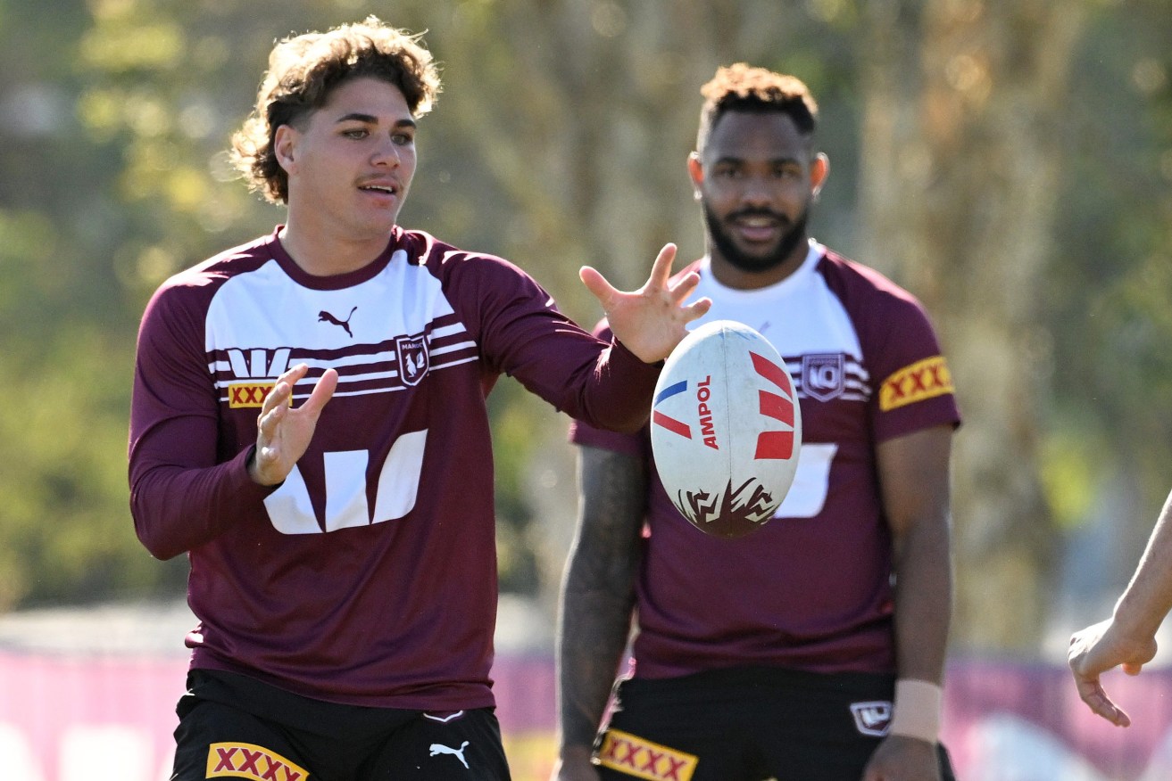 Hamiso Tabuai-Fidow looks on to Reece Walsh during a Queensland Maroons State of Origin training session at Sanctuary Cove on the Gold Coast, Monday, June 24, 2024. (AAP Image/Dave Hunt) 