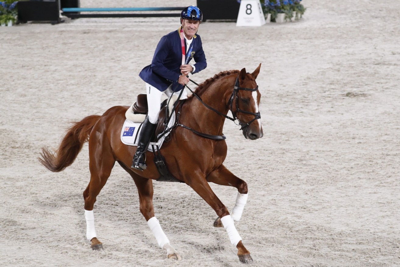 Andrew Hoy of Australia riding Vassily De Lassis after winning the bronze medal during the Equestrian events of the Tokyo 2020 Olympic Games at the Baji Koen Equestrian Park in Setagaya, Tokyo, Japan, 02 August 2021. EPA/KIYOSHI OTA
