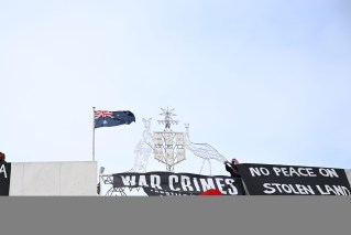 Going over the top: Pro-Palestine activists take protest to roof of Parliament House
